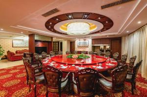 a large dining room with a large table and chairs at Nanchang Oriscene Garden Hotel in Nanchang +214 photos