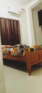 a bed sitting in a room with at THE FARM CREST, ECR KADALLUR in Kūvattūr