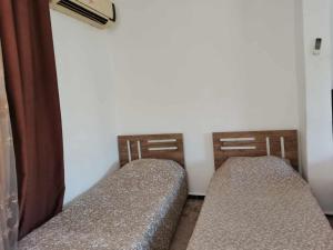 Ένα ή περισσότερα κρεβάτια σε δωμάτιο στο Flowar