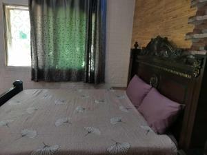 Ένα ή περισσότερα κρεβάτια σε δωμάτιο στο Flowar