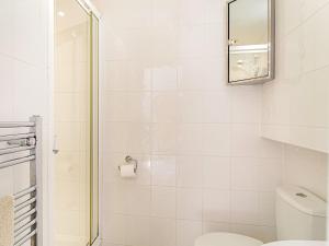 a bathroom with a shower and a toilet at 3 bed property in Overstrand KT178 in Overstrand +10 photos