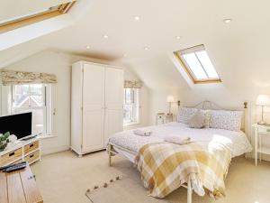 a bedroom with a bed and a skylight at 3 bed property in Overstrand KT178 in Overstrand