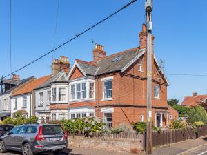 a brick house with a car parked in front of it at 3 bed property in Overstrand KT178 in Overstrand