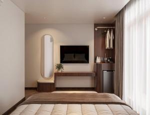 Postel nebo postele na pokoji v ubytování Chingu Boutique 2