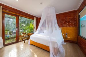 Ένα ή περισσότερα κρεβάτια σε δωμάτιο στο Hese Ecolodge Phu Quoc