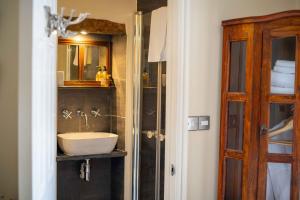 a bathroom with a sink and a shower at The New White Lion in Llandovery +58 photos