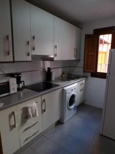 Kuchyň nebo kuchyňský kout v ubytování Santiago 30, 1A