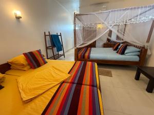 Postel nebo postele na pokoji v ubytování Samaru Beach House