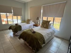 Ένα ή περισσότερα κρεβάτια σε δωμάτιο στο Jubilee Guesthouse