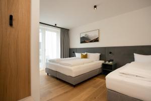 Postel nebo postele na pokoji v ubytování milu Apartments - Fiss