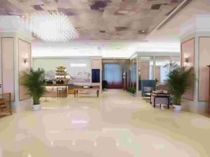 a rendering of a lobby with tables and plants at Mercure Wuhan Yangluo in Wuhan