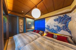 Ένα ή περισσότερα κρεβάτια σε δωμάτιο στο Japanese Modern Great Access Shinjuku 4Bed