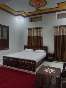 Una cama o camas en una habitación de Peace Ace Homestay Jaisalmer