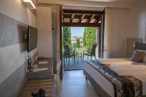 Ένα ή περισσότερα κρεβάτια σε δωμάτιο στο Hotel Relais Agli Olivi +76 φωτογραφίες