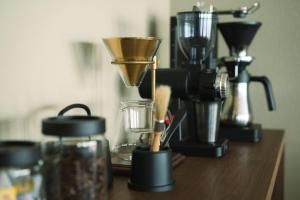 a counter top with a blender and other appliances at TORIKKA Stay -ビーチに建つ貸別荘- in Sumoto +26 photos