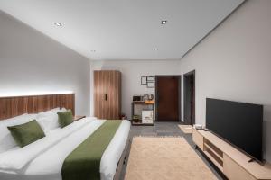 Postel nebo postele na pokoji v ubytování الاورفلي للوحدات السكنية