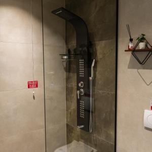 a shower with a glass door in a bathroom at Hotel Ari in Gjakove +27 photos