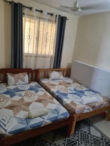 Postel nebo postele na pokoji v ubytování Dee Apartment