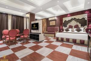a hotel room with a bed and a checkerboard floor at Hotel Shady Oaks by Stay Pattern in Srinagar