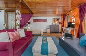 a living room with a couch and a table at À Deux Pas ... in Briançon