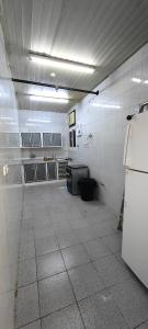 an empty room with a kitchen with a refrigerator at قمة قباءلشقق المفروشه in Al Madinah