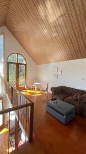 a living room with a couch and a table at Umacabana 2 in Dieng