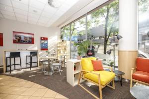 a waiting room with chairs and a table at Ibis Praha Mala Strana in Prague