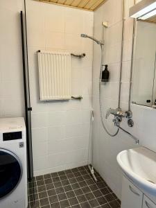 a bathroom with a shower and a sink at Beautiful home in the center of Rovaniemi in Rovaniemi