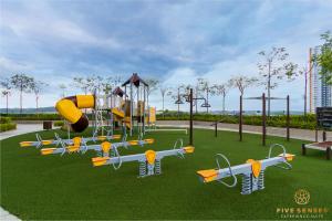 a playground with a slide and airplanes on the grass at KIP Core Soho Suite by Five Senses in Sepang +17 photos