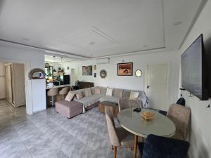 a living room with a couch and a table at Dar Julia in Sousse