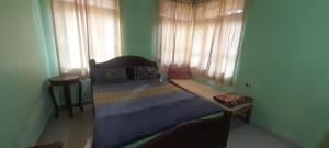 a small bed in a room with a window at G shepherd Villas And Apartments in Colva +9 photos