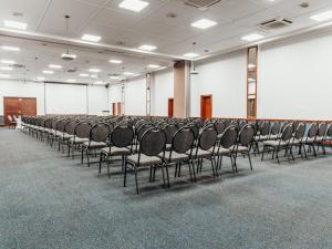 a row of chairs in a large room at ANEW Resort Wilderness Garden Route in Wilderness +125 photos