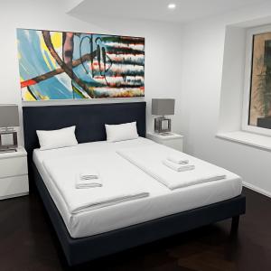 Postel nebo postele na pokoji v ubytování City Center Apartments