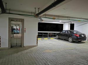 a car parked in a parking lot in a garage at Central Location, Breathtaking Views! in Addis Ababa