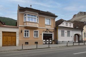 a building on the side of a street at Casa Monte Verde in Braşov