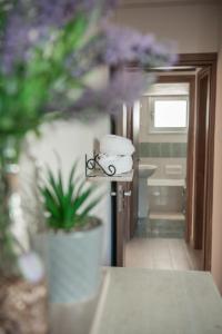 a pile of towels sitting on a rack in a bathroom at Bluewave Apartment in Pyla +29 photos