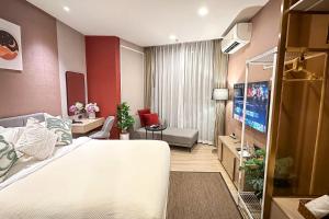 Ένα ή περισσότερα κρεβάτια σε δωμάτιο στο Edge Central Pattaya-Skyline Retreat +82 φωτογραφίες