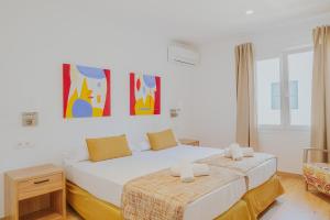 En eller flere senge i et værelse på Villa Santo Tomás - Adriana