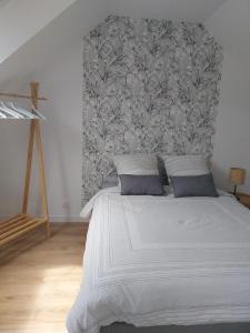 a bedroom with a large bed with a large headboard at Disneyland Paris dream 2 rooms & breakfast in Magny-le-Hongre
