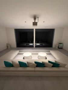 a living room with a couch with pillows at Amatera in Kami Amakusa +9 photos