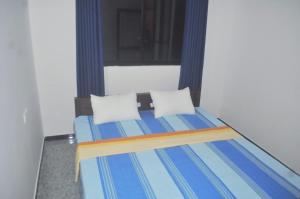 Ένα ή περισσότερα κρεβάτια σε δωμάτιο στο Miracle Home Stay +14 φωτογραφίες