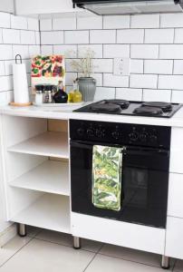 a kitchen with a stove with a towel on the oven at Coffee Bean Home in Windhoek