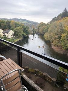 a view of a river with people kayaking in it at Whitewater Hotel & Spa in Newby Bridge