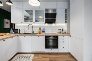 Køkken eller tekøkken på Lumina luxury apartment with parking