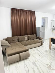 a living room with a couch and a table at Apartament Giovanni in Giroc +139 photos