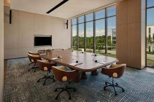 a large conference room with a large table and chairs at Suzhou Marriott Hotel Yangcheng Lake in Suzhou +23 photos