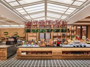a bakery with a buffet of food on display at Fairmont Chengdu in Chengdu