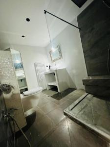 a bathroom with a toilet and a sink and a desk at Sea View Appartement a la Marsa plage in Douar el Hafey
