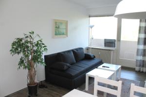 TV a/nebo společenská místnost v ubytování Ferienwohnung F331 für 2-4 Personen an der Ostsee