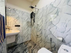 a bathroom with a sink and a toilet at Bosilu Villa in Weligama +59 photos